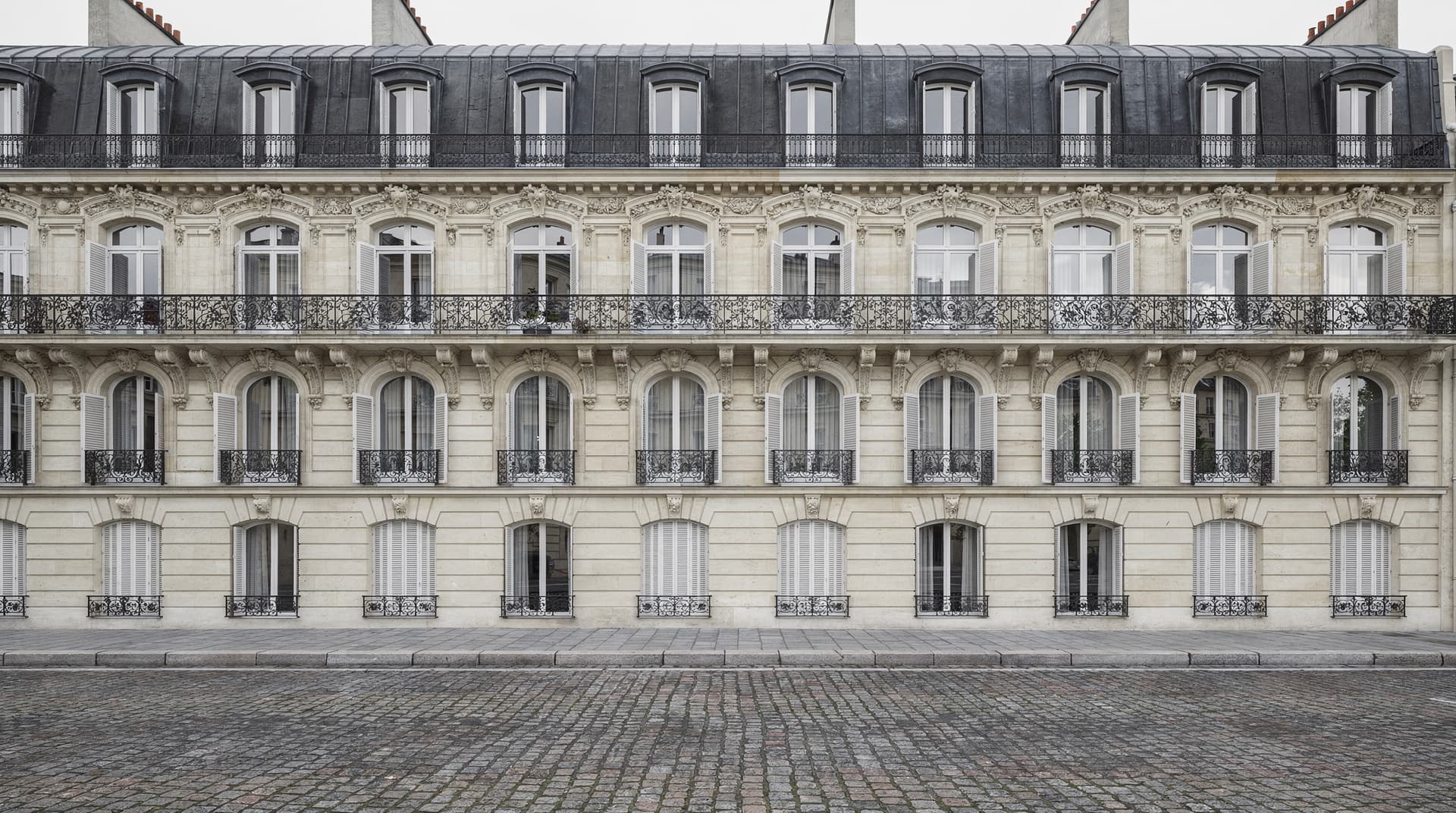 AI-generated photorealistic render of a renovated historic Flemish townhouse with sandstone facade and stepped gable, Archvisio